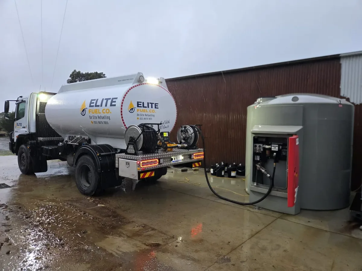 An on-site diesel storage tank being filled by Elite Fuel Co. in the rain